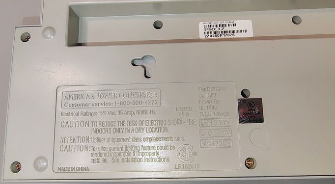 Product information label showing electrical ratings, TVSS ratings, and certification markings.