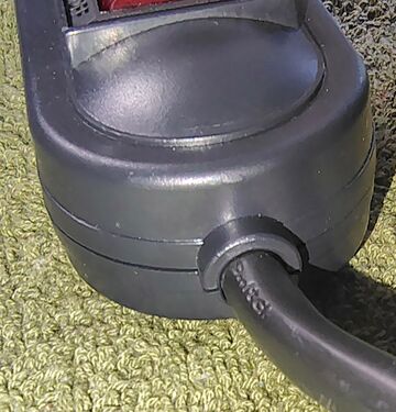 Power cord entry and strain relief.