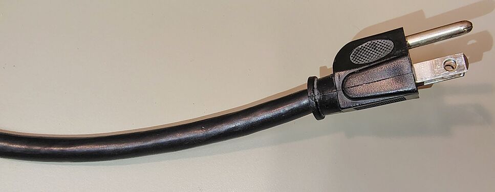 Heavy-duty approximately nine-foot power cord and molded grounding attachment plug.