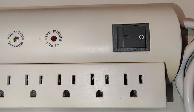 Rocker switch, cord-entry location, and outlet detail.