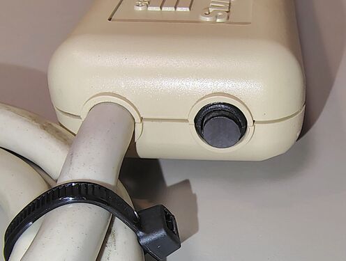 Power cord entry and resettable circuit breaker.