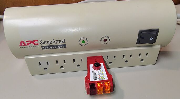 Outlet tester indicating correct wiring and grounding.