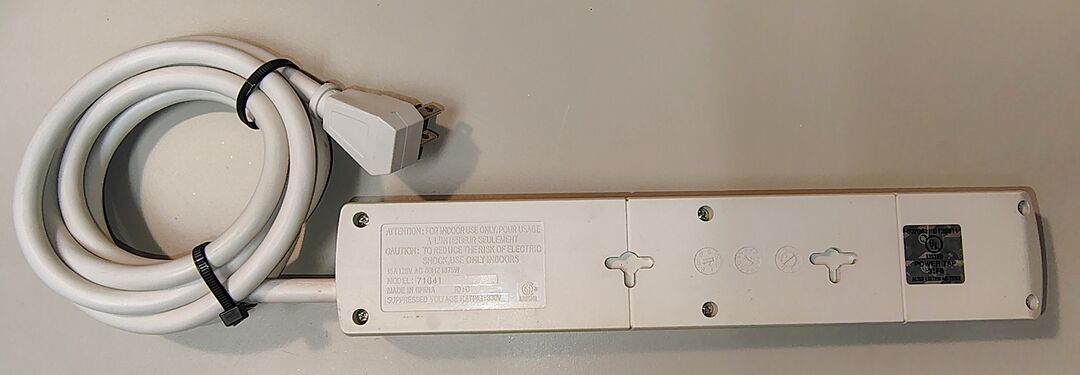 Underside view showing mounting provisions, date wheels, and product markings.
