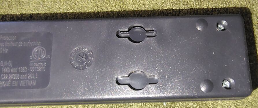Wall-mounting slots and molding date code.