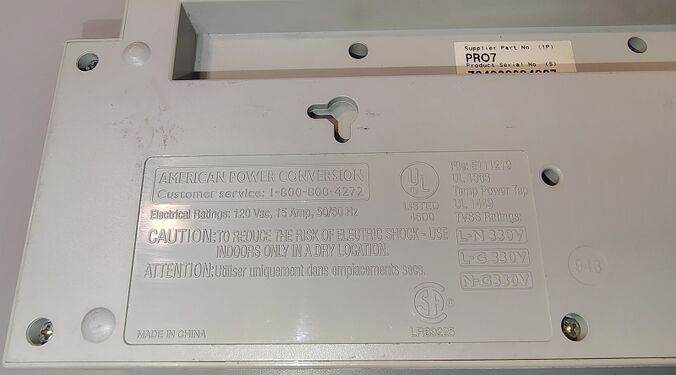 Model identification, safety markings, TVSS ratings, and serial-number label.