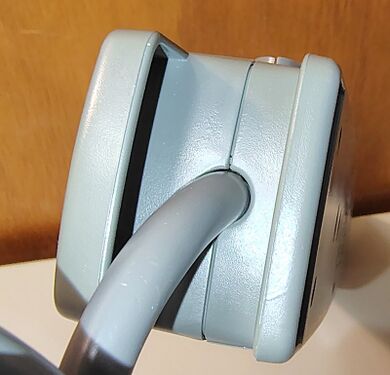Cord-entry end showing the integrated cord-storage guide and strain-relief arrangement.
