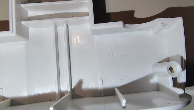 Interior housing markings and molded structural features.