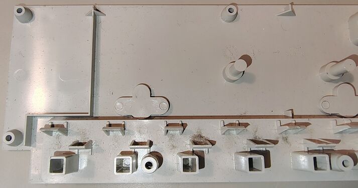 Interior details of the upper housing showing outlet barriers, support structures, and accumulated debris.