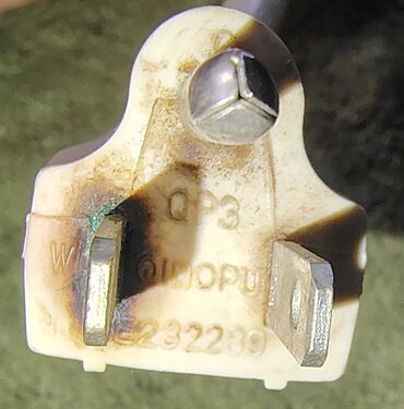 Heat-damaged attachment plug.