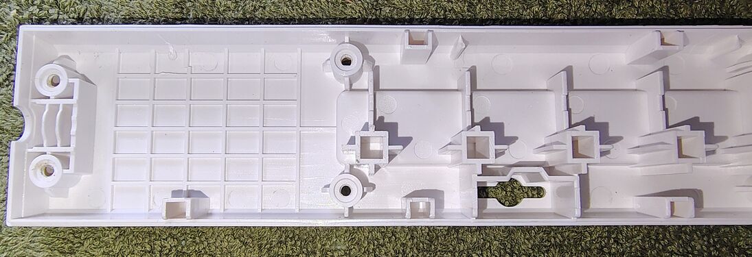 Upper housing details at the control-section end.