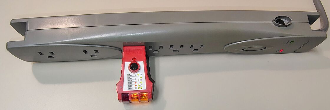 Outlet tester indicating correct wiring polarity and grounding.