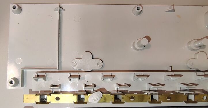 Interior details of the upper housing showing outlet barriers and grounding-bus-bar supports.