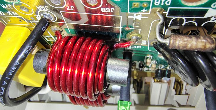 Close-up view of the EMI/RFI filtering inductor and surge-suppression components.