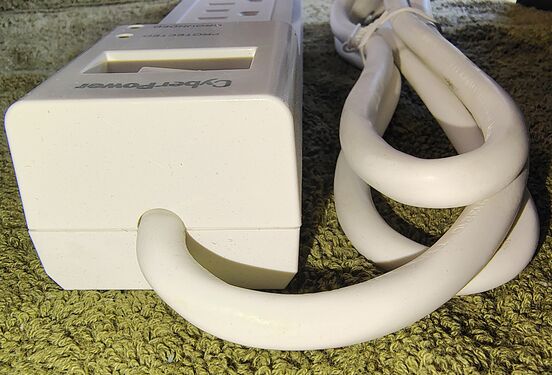 Cord-entry end showing the power-cord strain relief.