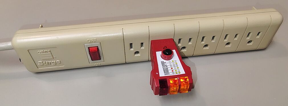 Outlet tester indicating correct wiring and grounding.