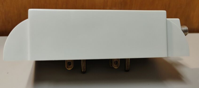 Opposite side profile showing wall-hugger construction and dual-plug mounting arrangement.