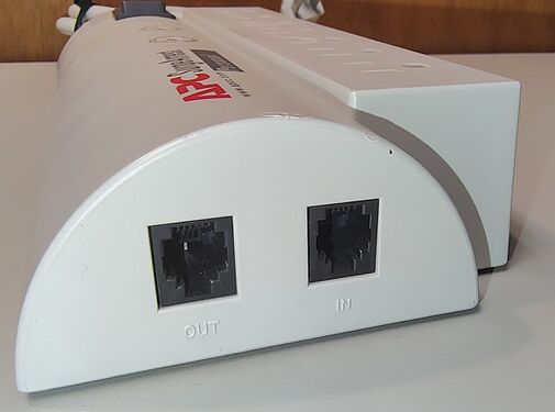 Telephone-line protection ports with input and output connections.