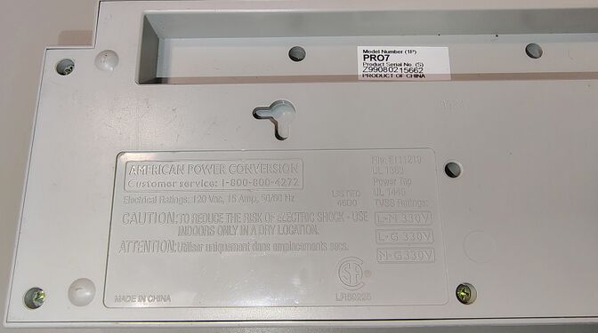 Model identification, safety markings, TVSS ratings, serial-number label, and molded markings.
