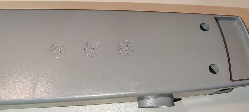 Molded date wheels indicating manufacture on 20 October 2002.