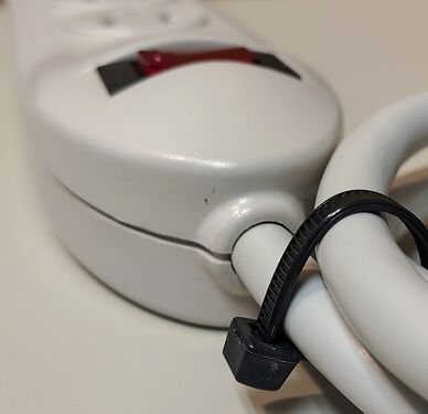 Cord-entry end showing strain relief, enclosure shape, and switch housing profile.