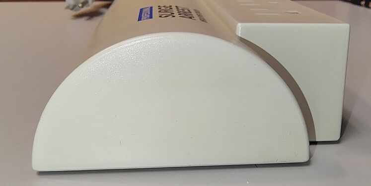 Side profile showing enclosure construction, outlet arrangement, and overall condition.