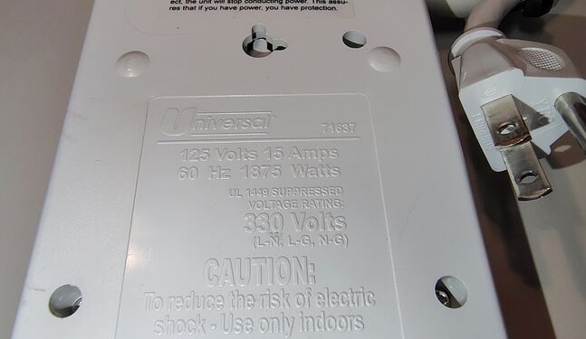 Model and electrical specifications molded into the underside of the housing.