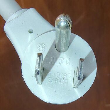 Right-angle attachment plug with approval markings.