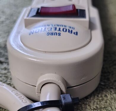 Cord-entry end with switch and strain relief.