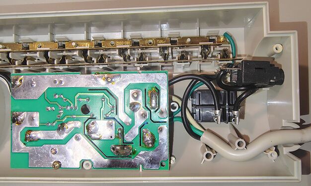Switch-end wiring, circuit-breaker assembly, and underside of the suppression circuit board.