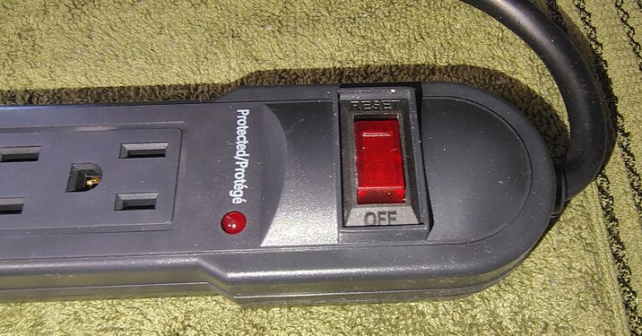 RESET/OFF switch and protection indicator.