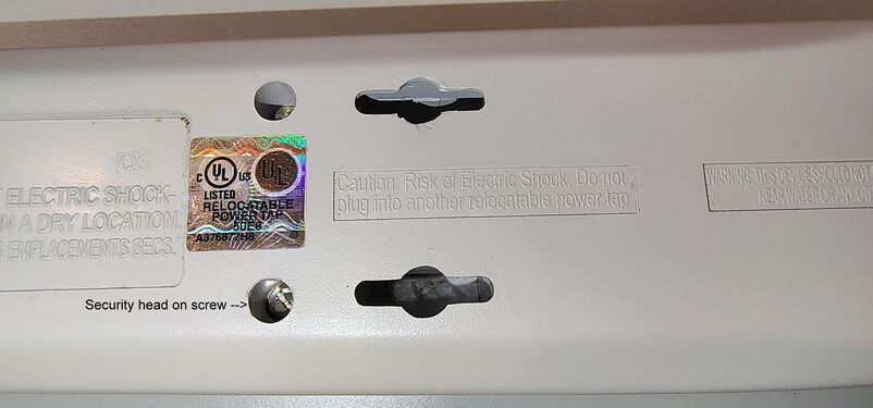 UL listing label, wall-mount slot, and safety markings.
