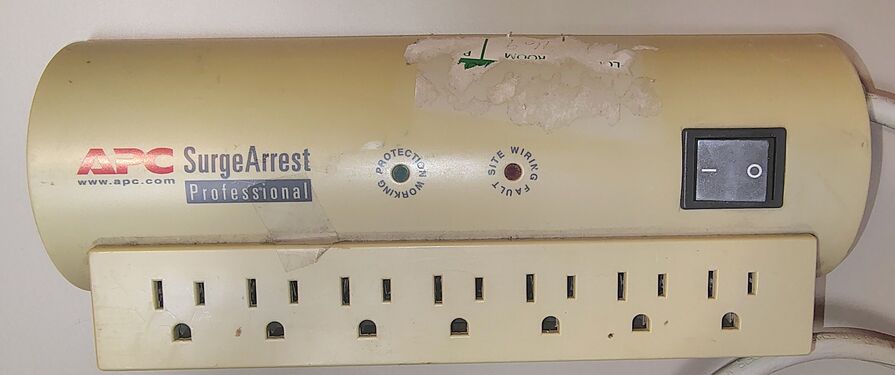 Close-up of the documented example showing adhesive residue, discoloration, and accumulated dirt prior to cleaning.