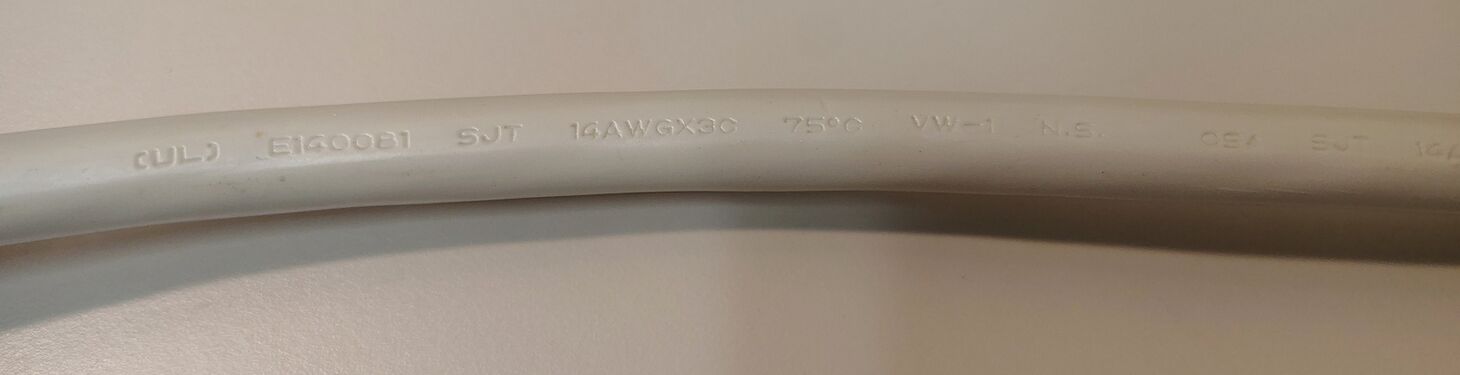 Power-cord markings showing cord type, conductor size, temperature rating, and approval information.
