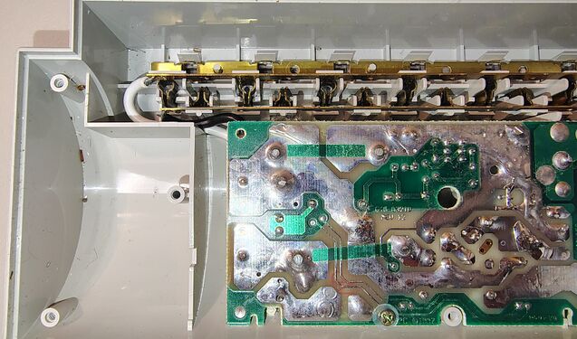 Suppression circuit board installed within the lower enclosure showing outlet-contact assemblies and bus bars.