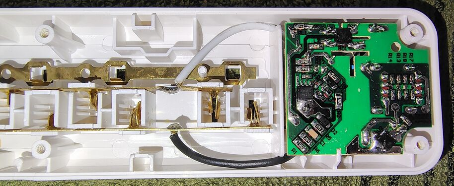 USB charging circuit board and outlet-contact assemblies.