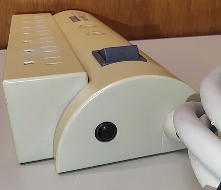 Cord-entry end showing the switch and status indicators.