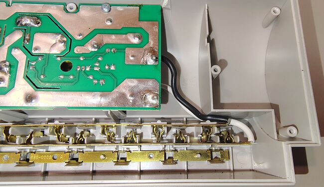 Outlet end showing contact assemblies and PCB connections.
