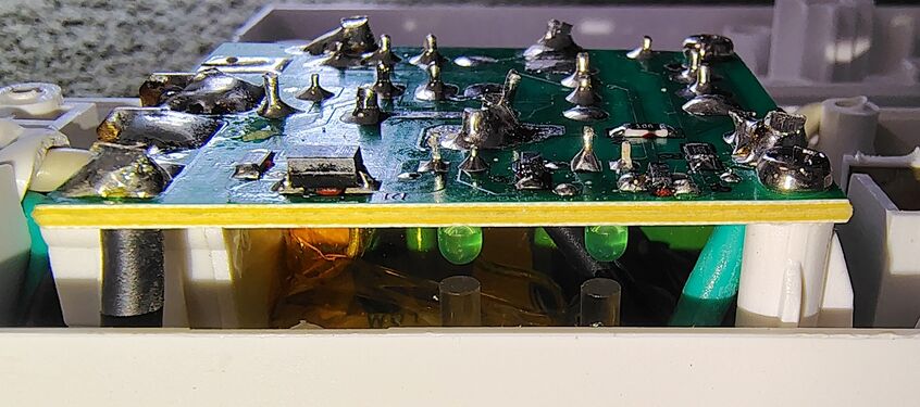 Side view of the control-section circuit board showing indicator LEDs and internal components.