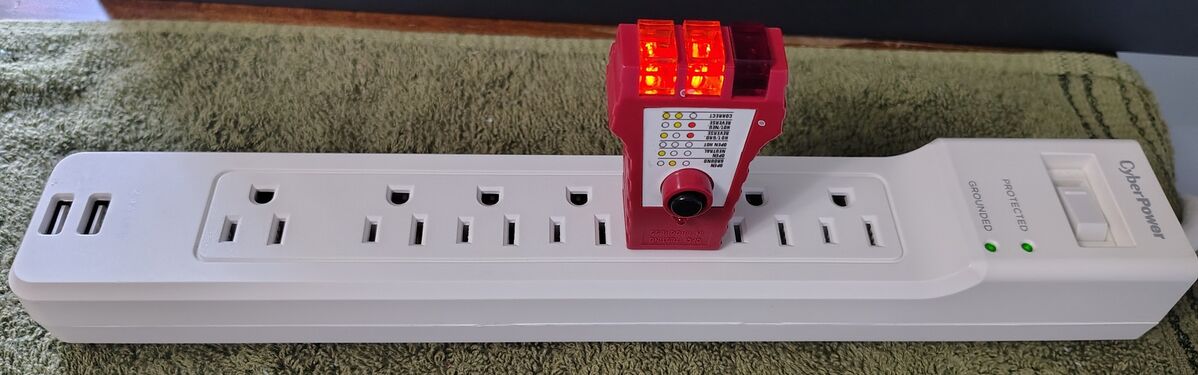 Outlet tester indicating correct wiring and grounding.