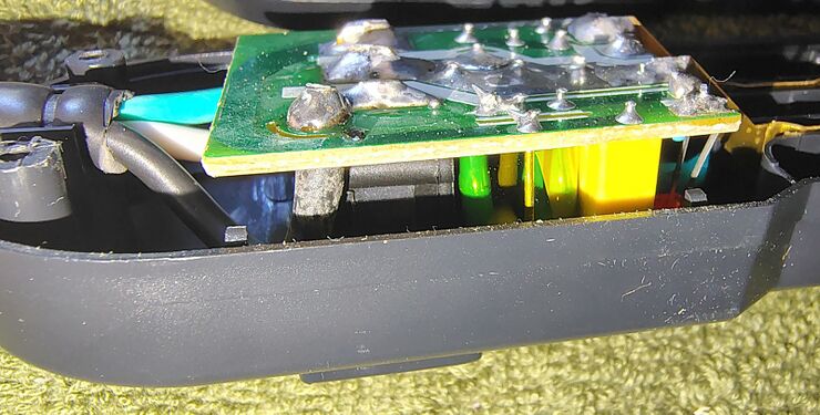 Circuit board components beneath the PCB.