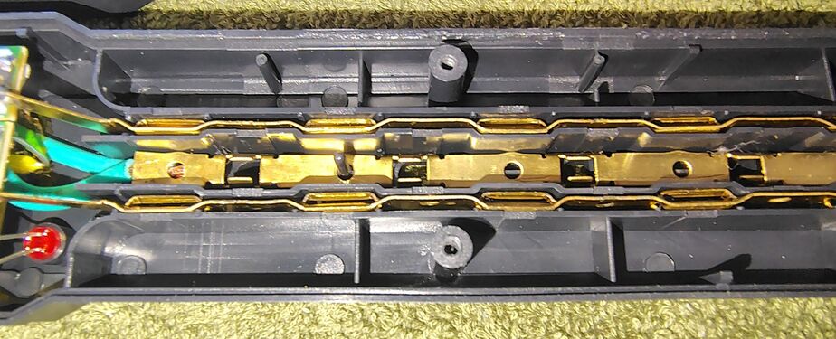 Center section showing bus bars and outlet contacts.