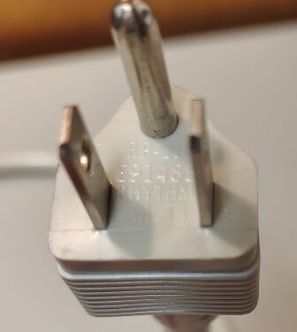 Power plug with molded approval markings.