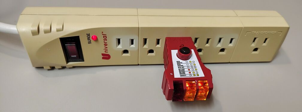 Outlet tester indicating correct wiring and grounding.