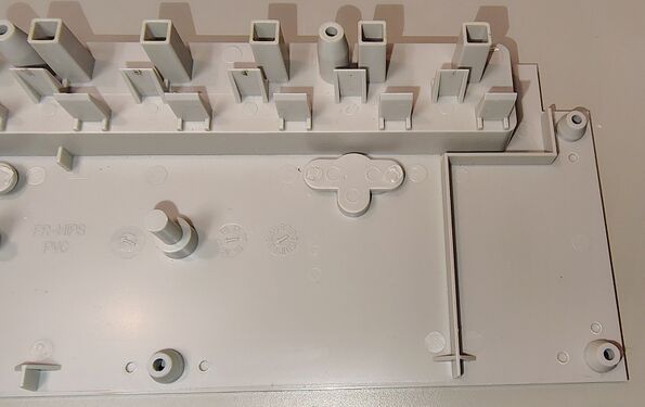 Upper housing showing outlet barriers and mounting structures.