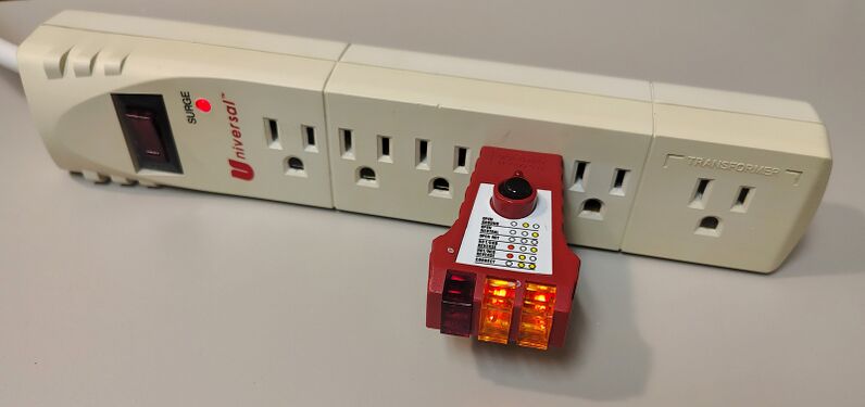 Outlet tester indicating correct wiring and grounding.