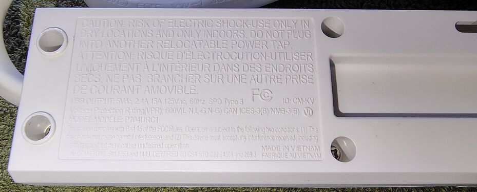 Underside specifications, ratings, and regulatory markings.