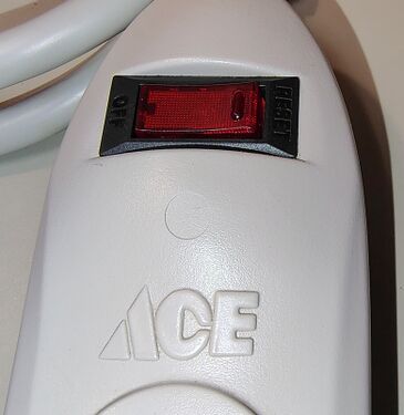 ACE branding and illuminated rocker switch assembly.