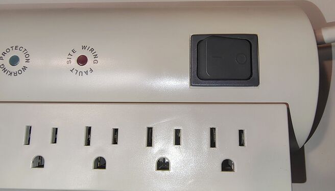 Power switch and indicator assembly showing Protection Working and Site Wiring Fault indicators.