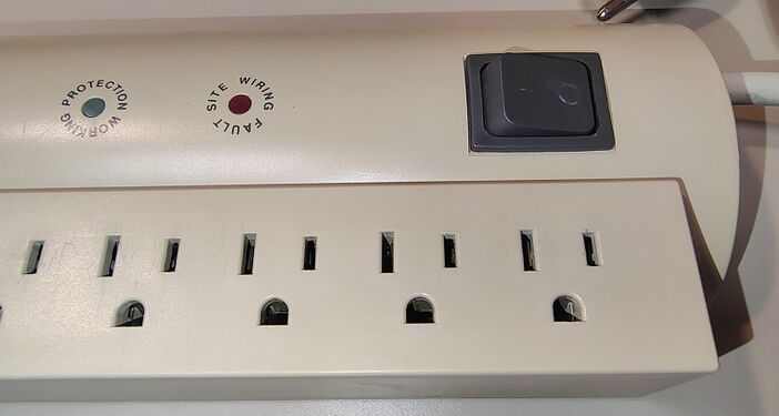 Power switch showing wear to the ON/OFF markings.