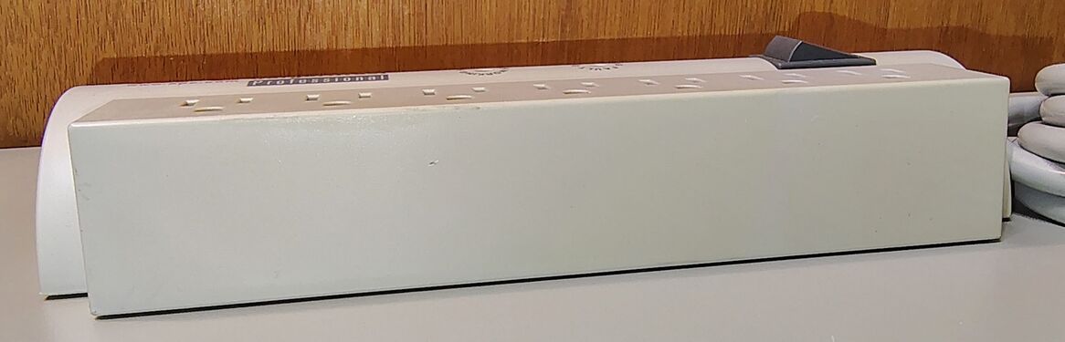 Side profile showing the enclosure design and outlet arrangement.